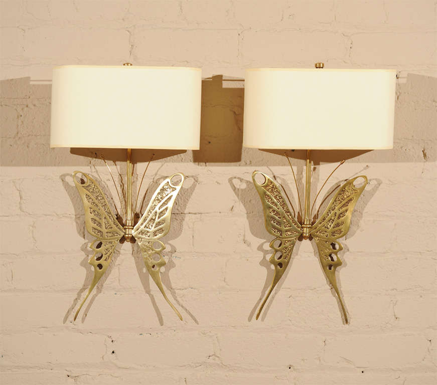 A unique and elegant pair of gilt/bronze Butterfly-motif wall sconces with shades.
France - circa 1960

Located at our Jackson Square showroom