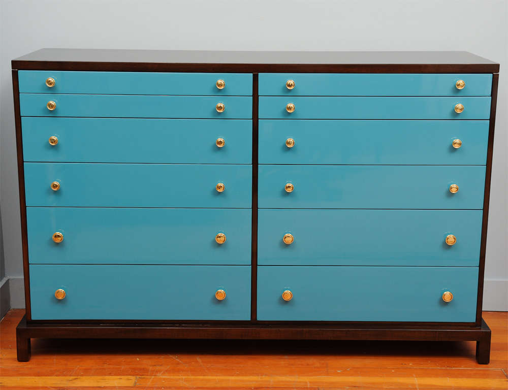 Large 12 drawer chest manufactured by Widdicomb Furniture Co. Completely refinished dark brown mahogany with blue lacquer drawers and polished brass pulls.
