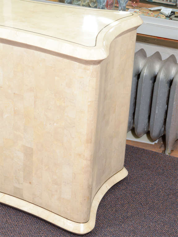 Console table made from tessellated fossil coral with brass inlay detailing.

