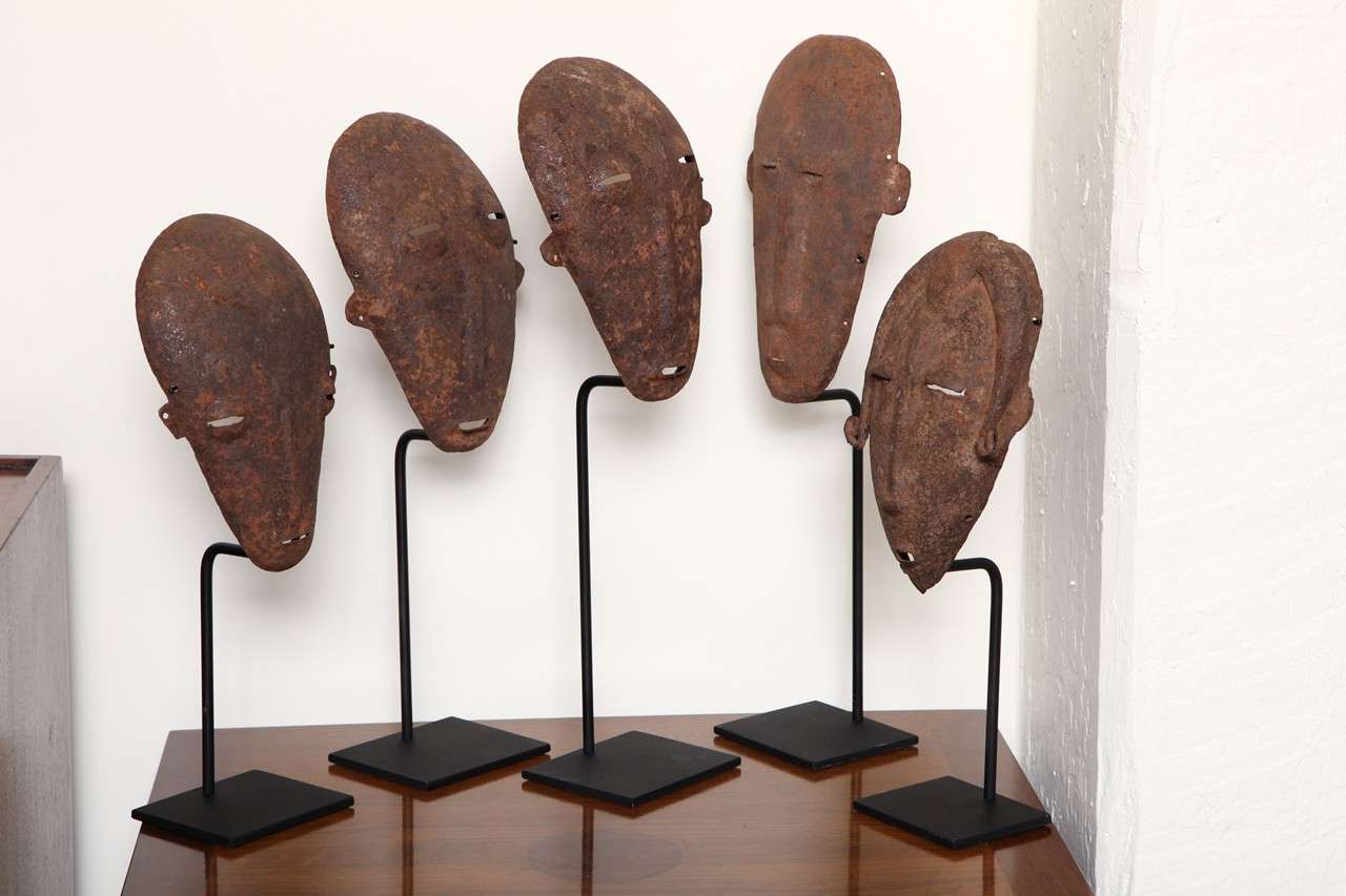 Iron initiation masks from the Bamama Tribe, Mali West Africa 
c. 1940 Sold individually. Mounted on iron stands with varying heights of 15