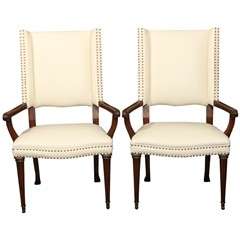 pair white leather and nailhead arm chairs