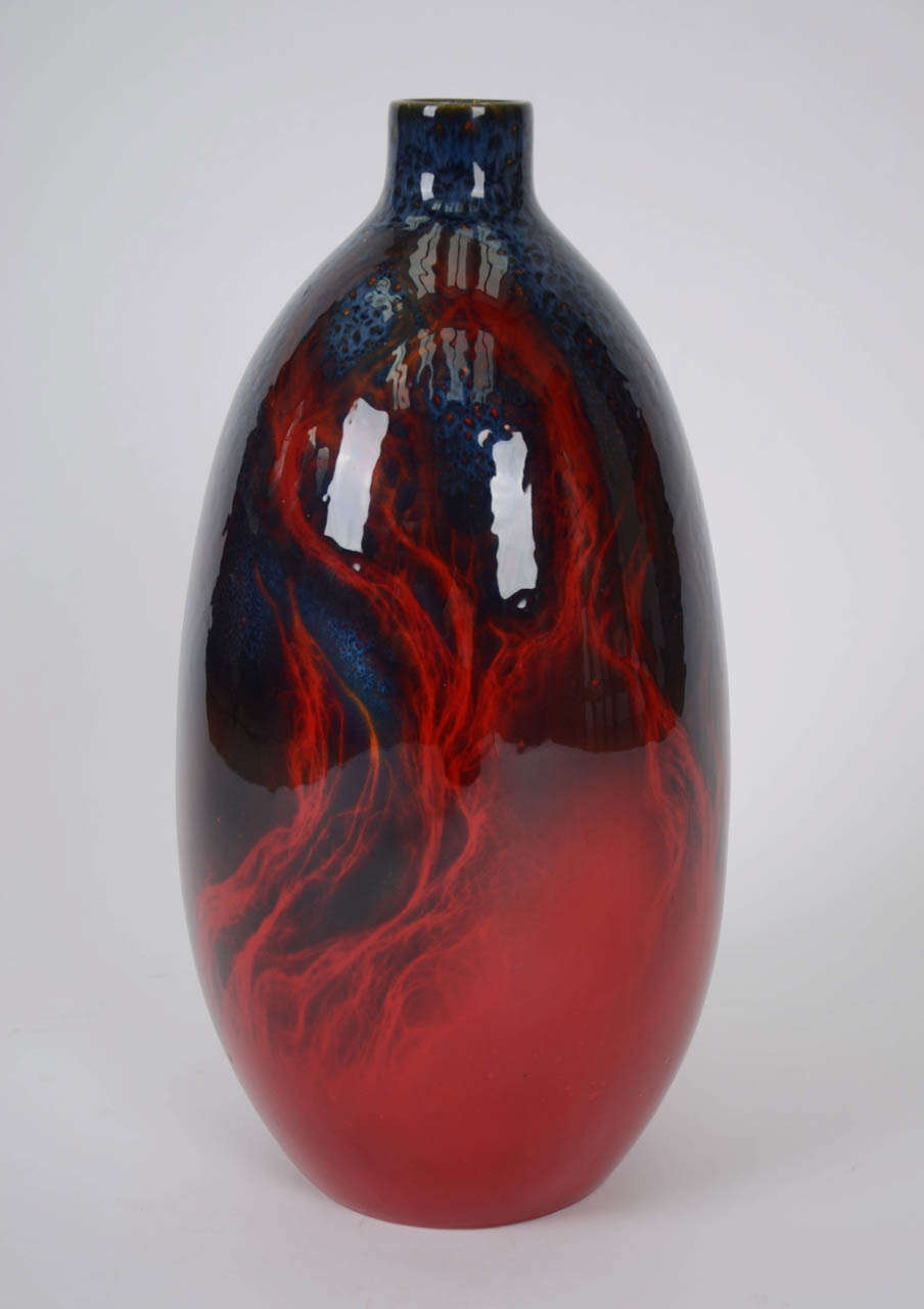 One of the most striking Doulton Veined Flambe vases I have seen . The high-fired effect of the Lavender glaze over the red Flambe ground creates a wide variety of colour tones from light blue to deep purple. The base is printed with the Royal