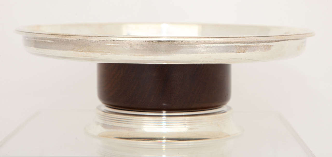 A French Art Deco Sterling and Ebony Compote designed by 
Jean E. Puiforcat circa 1930 in Pristine Condition. French Sterling Hallmark and 
EP the Puiforcat mark.