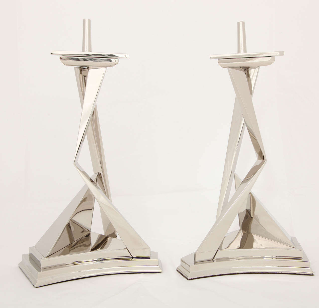 A pair of nickel-plated bronze candlesticks, 