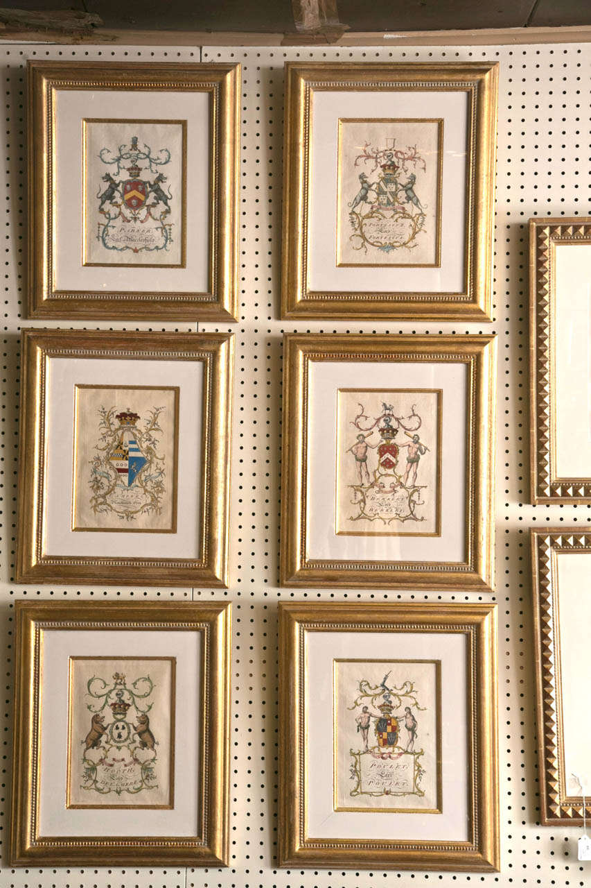 Each coat of arms  printed and hand colored within  gilt edged matts and gilt frames. The family names are:  
BOOTH, LORD DELAMERE/
POULET EARL POULET/
BERKLEY LORD BERKLEY/
CAMPBELL MAICHIONESS GREN/
PARKER, EARL OF TACCLEFIELD(?)/
 FORTESCU. LORD