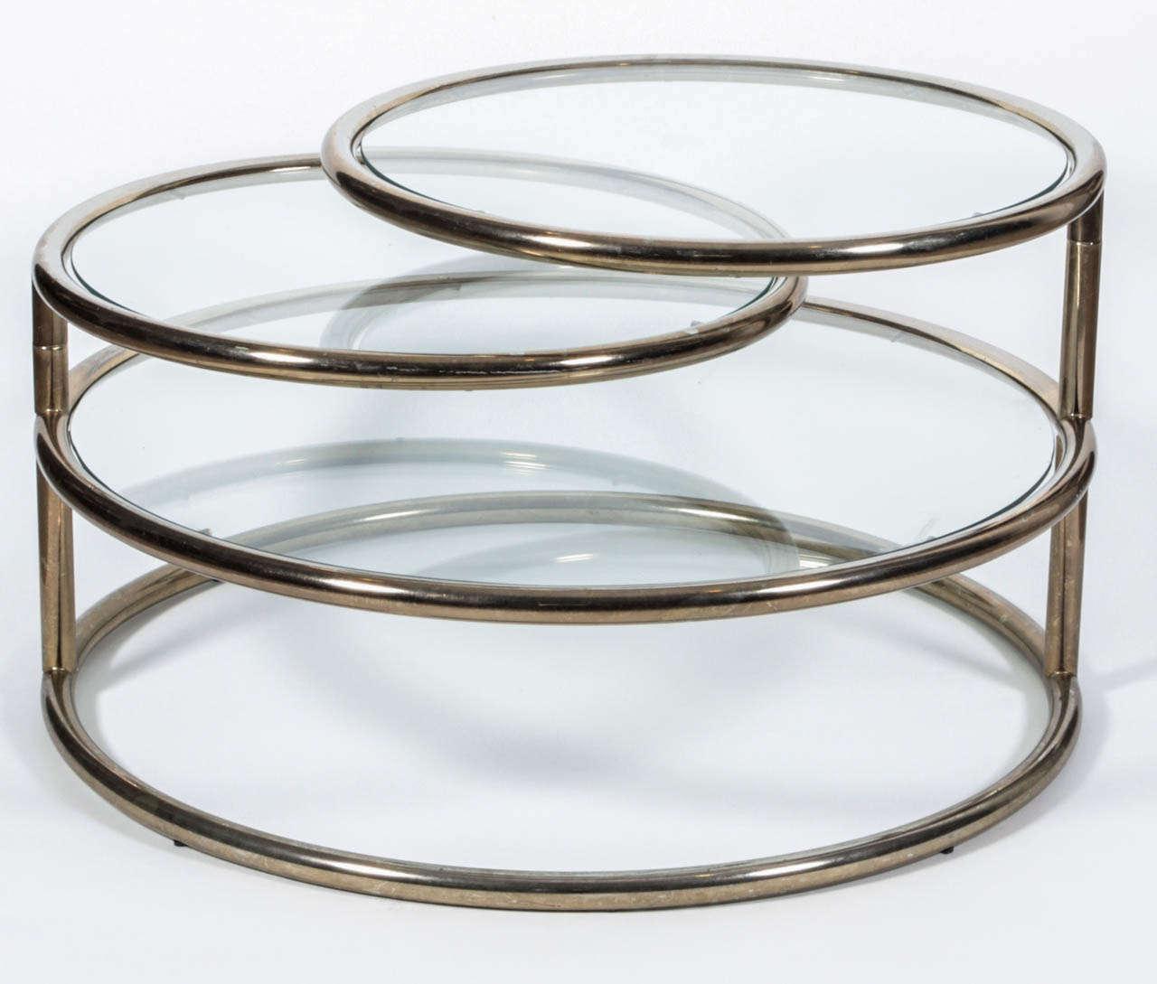 Light brass and glass circular cocktail table with three tiers.  USA, circa 1970.  Upper two tiers are adjustable. Width of table fully extended, approx. 78 inches.