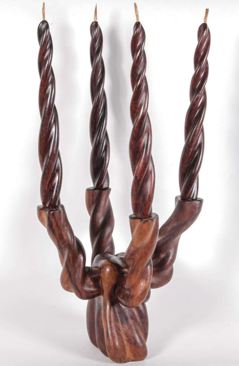 A four-arm candelabra hand-carved from wood by Dan Karner for 
Creaciones. 

Barcelona, Spain, circa 1970. 

Features decorative faux candles which may be removed and replaced with real candles. 

Signed.