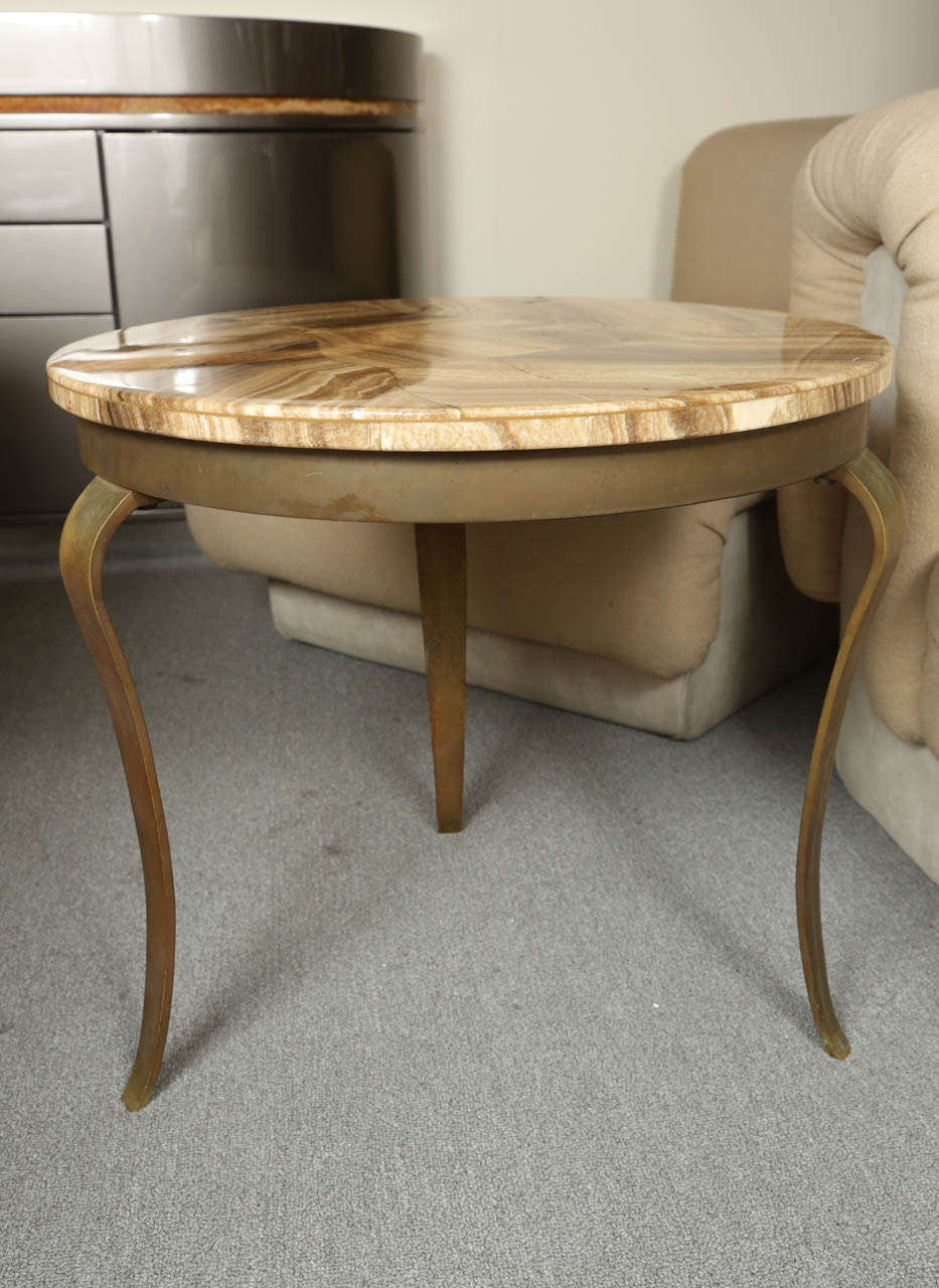 Charming side table with a metal base and  faux polished stone top.