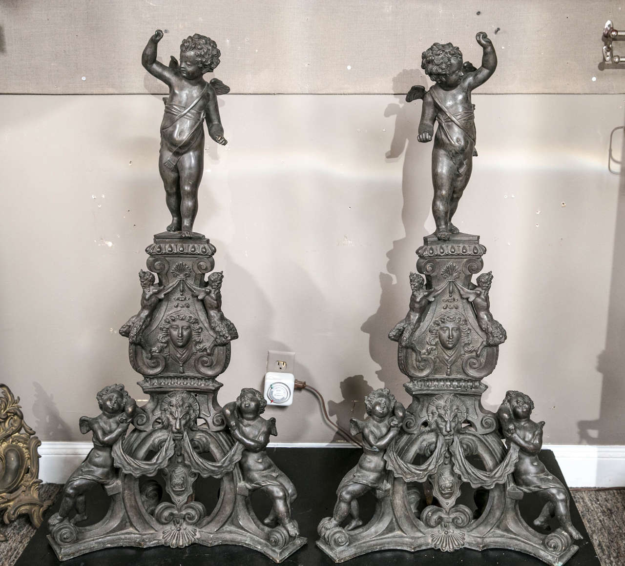 Monumental Pair of French Bronze Andirons  featuring Winged Putti from an important Newport, RI estate.