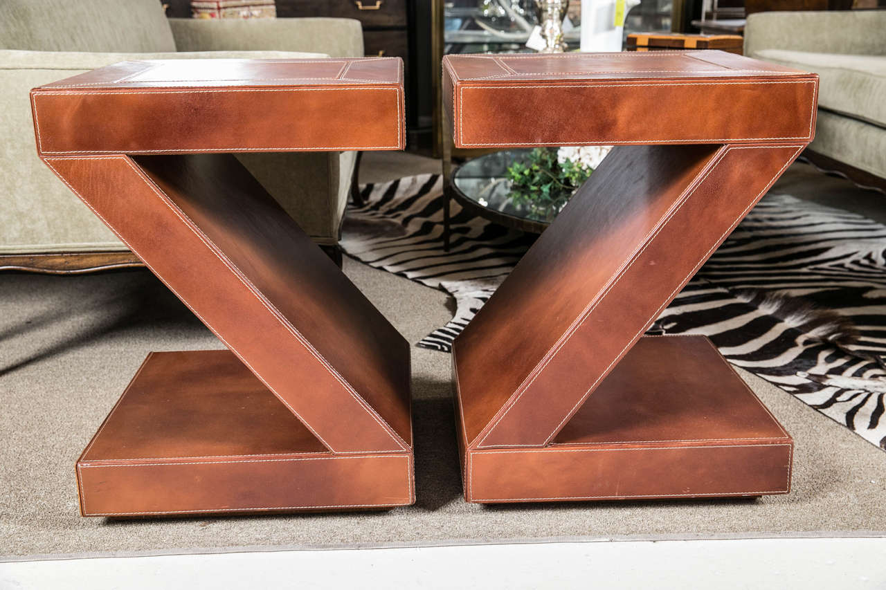 pair of Z form leather end tables with top stitching
