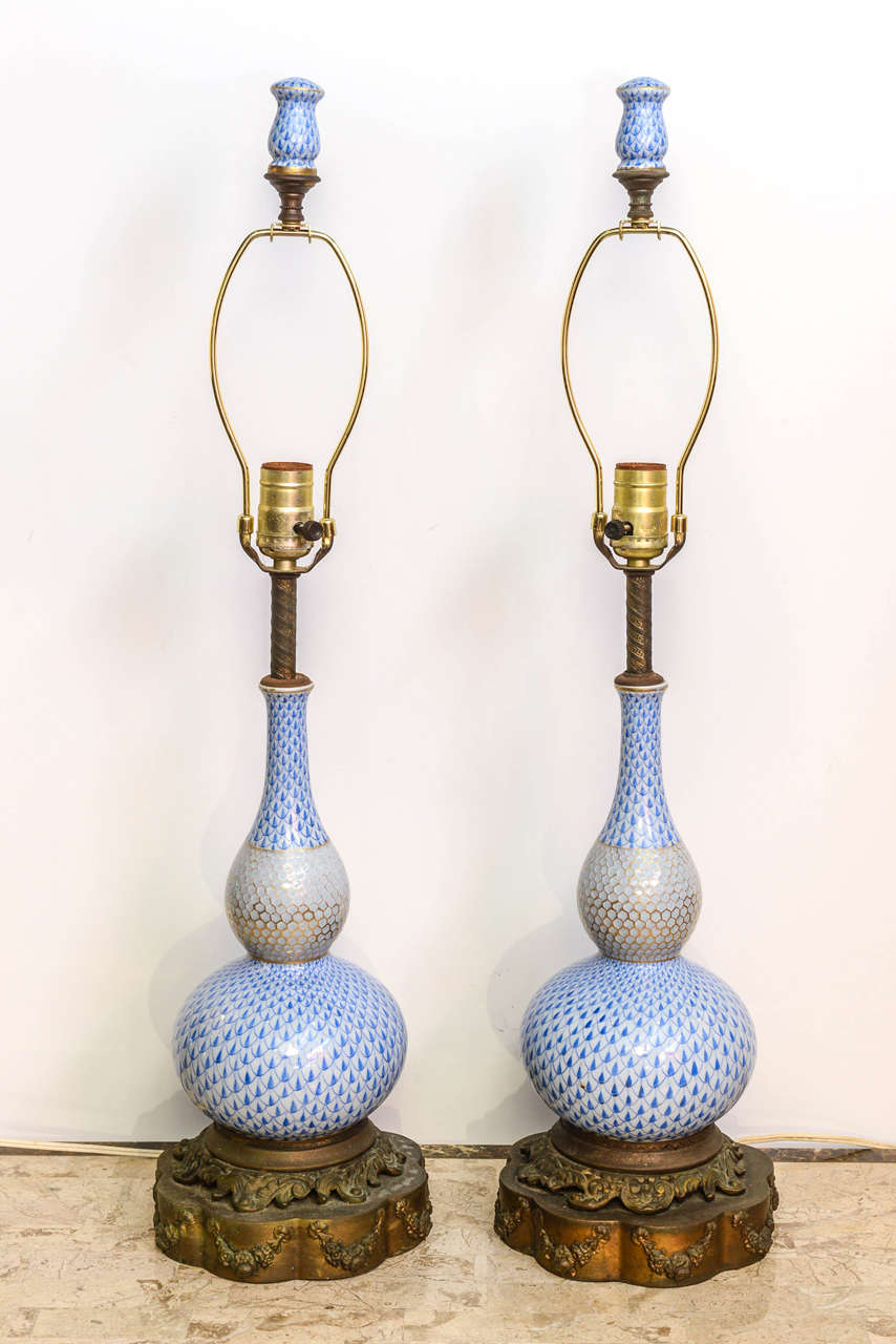 Pair of hand-painted Herend lamps, circa 1940s. Gourde shape, fully electrified and fitted with matching finials.