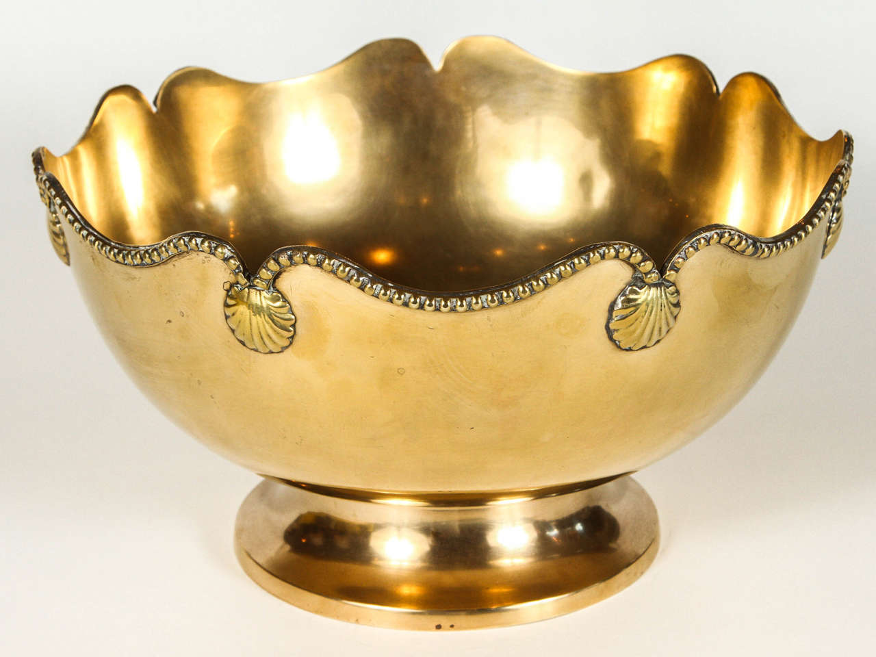 Vintage brass centerpiece bowl with beaded lip and clam shell decoration.