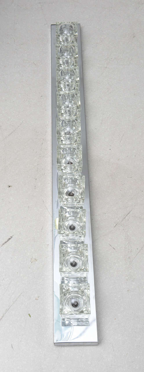 Super long vintage Sciolari chrome and glass cube light fixture which may be mounted as an overhead ceiling fixture or wall mount. The fixture has ten square glass ice cubes.