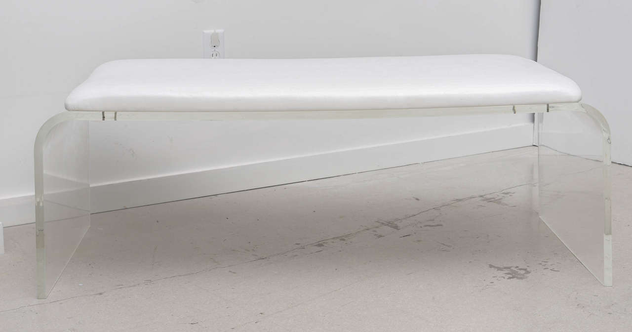 Vintage Lucite waterfall bench with white vinyl upholstered portion.