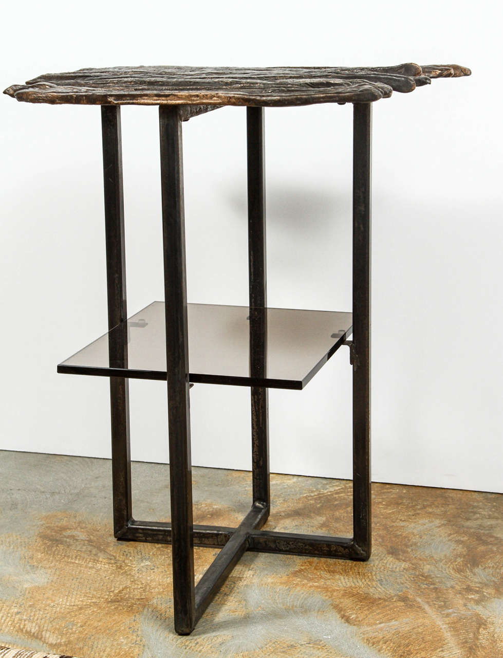 Modern, organic modern Paul Marra cast bronze Pod Table. Cast bronze and steel with bronze patina and with bronze tinted glass shelf. Two currently in stock; price is per table.