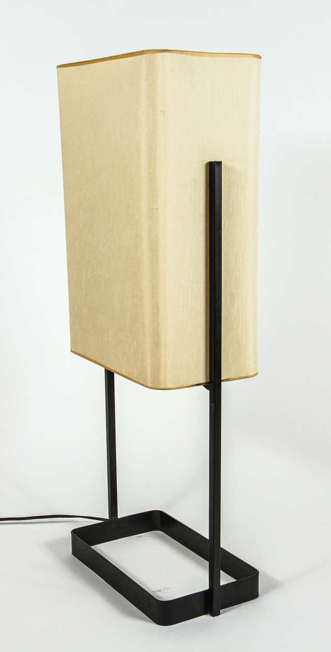 Iron table lamp with original paper shade.