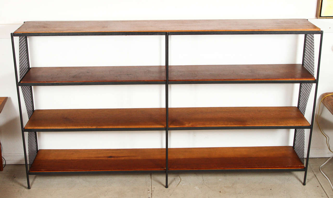 Wood and iron bookshelf with expanded metal sides from the 1950's.