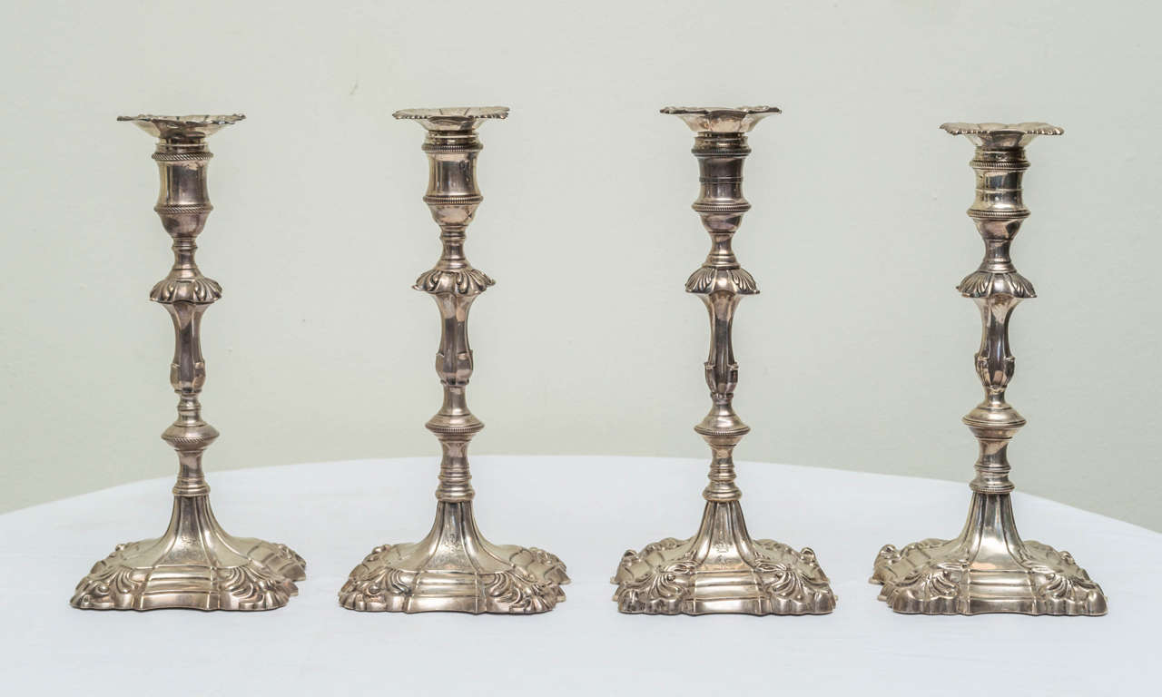 English cast sterling silver candlesticks, an assembled set of four. A matched pair by Wm. Cafe dated 1758, period of George ll . The other pair with no armorial or monogram, by Wm. Cafe dated 1759, period of George ll. One pair with the same