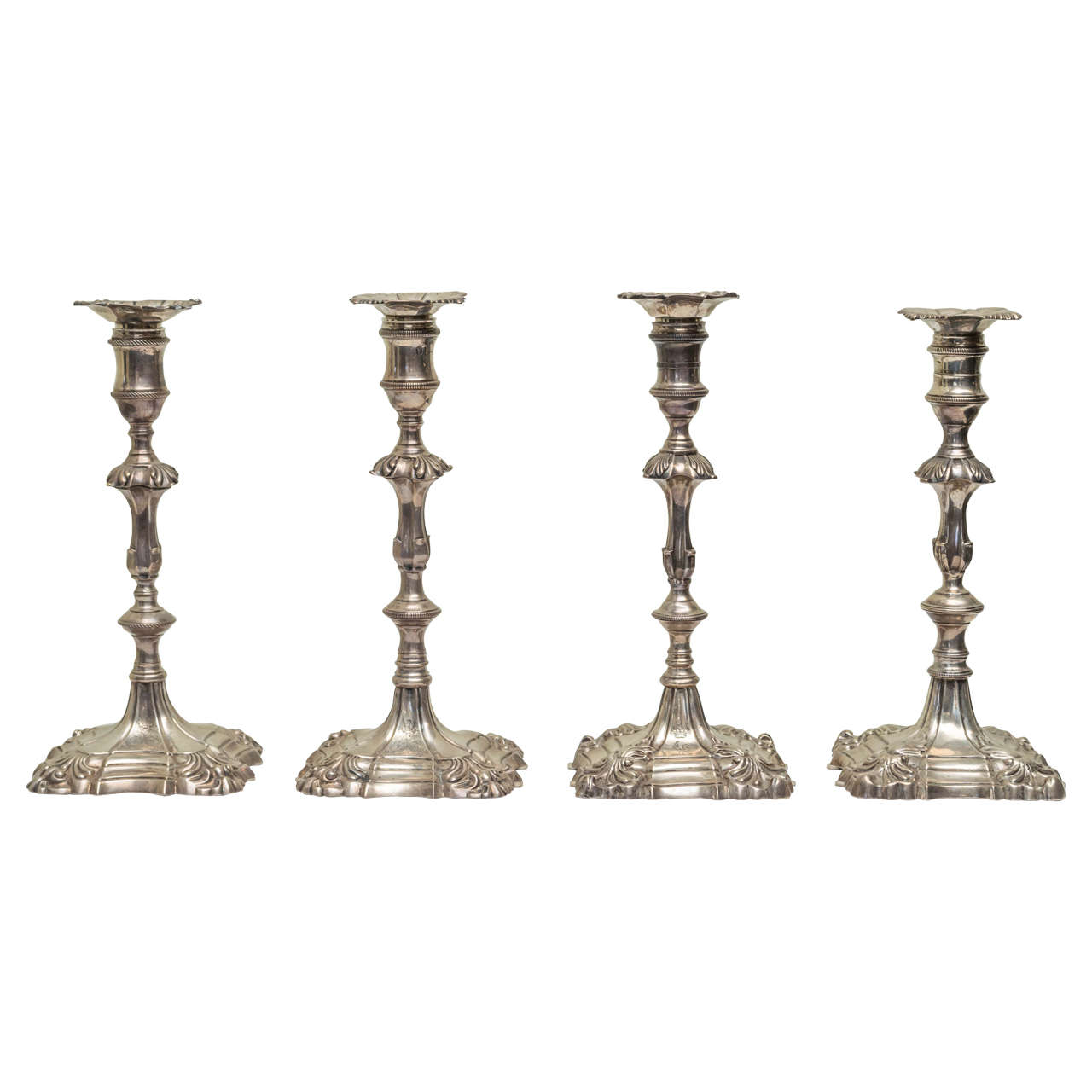 English Cast Sterling Silver Candlesticks in an Assembled Set of Four For Sale