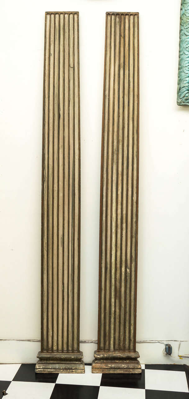 Pair of early 20th century architectural pilaster columns from the 1915 Panama Pacific Exposition. In the Classic revival style with good preserved original green painted surface. Width is 14.5 inches and tapers to 9.5 inches at the top.