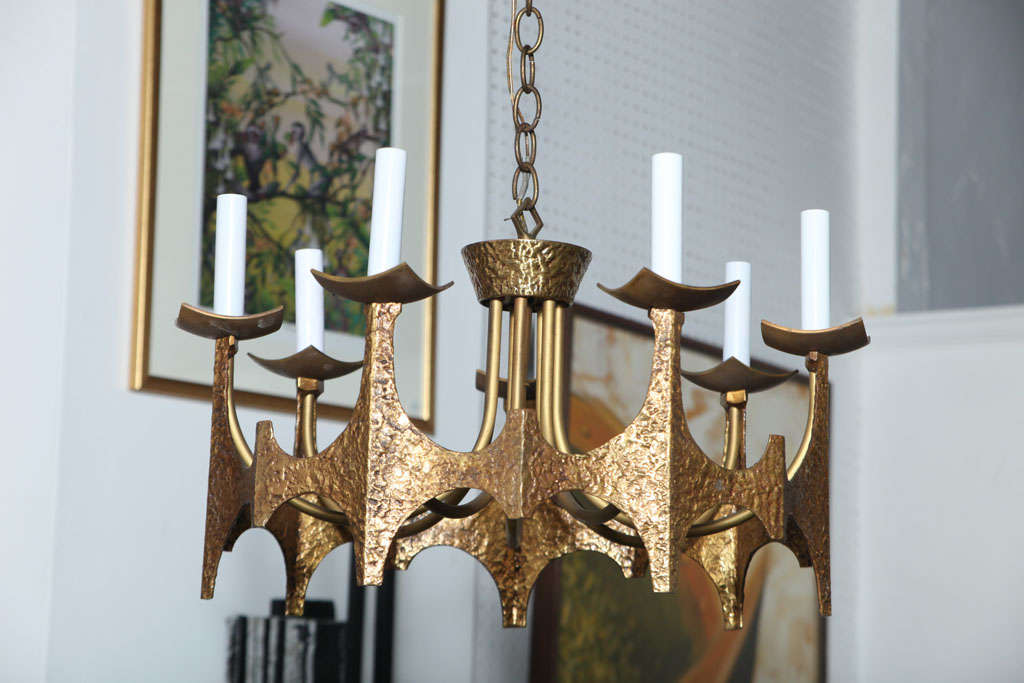 in the style of Paul Evans Beautiful unique solid brass chandelier ... very 70's....Modern with a touch of Medieval....