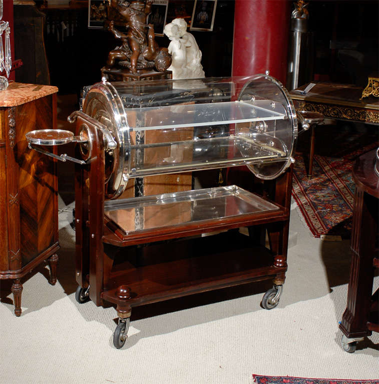 Incredible piece of history from the Commerce Club in Atlanta, Georgia! A beautiful Cristofle mahogany dessert cart on wheels with a revolving domed cover. The dessert tray inside slides out as the top revolves open.