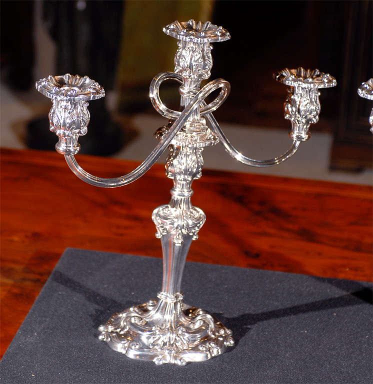 A fine pair of silver plated candelabras.