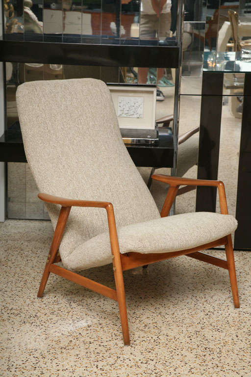 We just might change our opinion on recliners! A delicate wood frame, tall curvy back, and solid brass fittings give this dual position Swedish lounge chair uncommon good looks.
