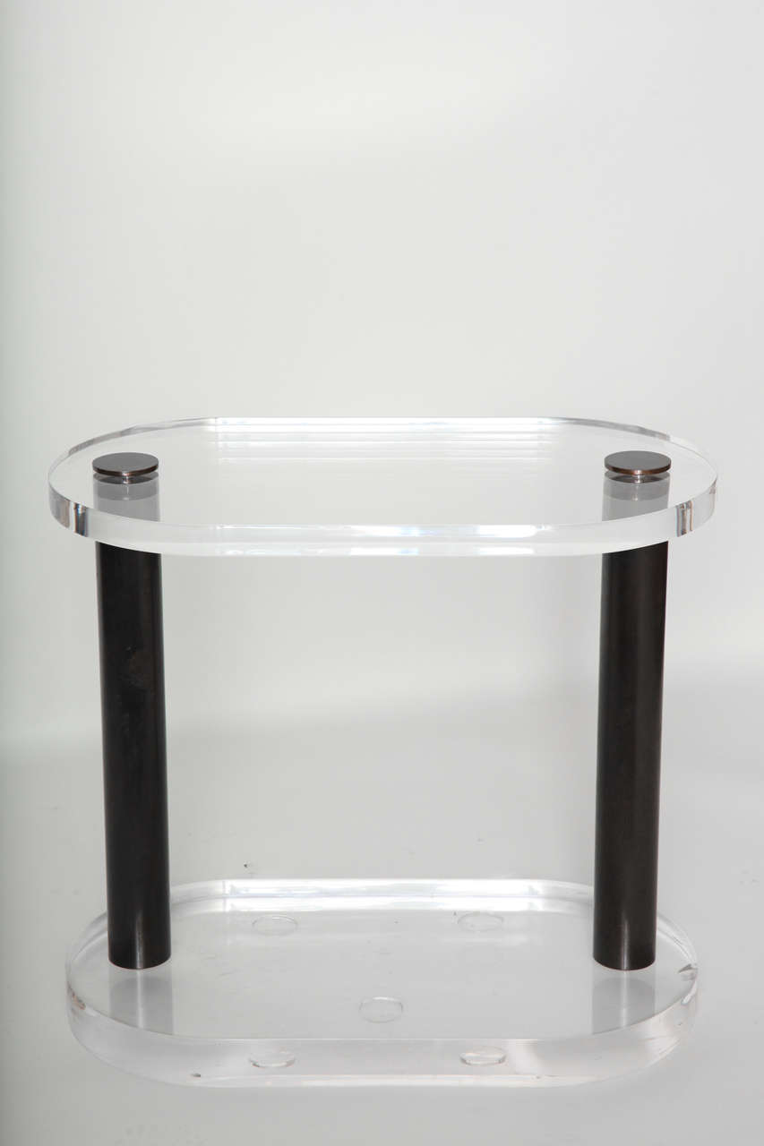 Unique one of a kind modern 1970s console able in the style of Karl Springer with thick Lucite base and top with oil rubbed bronze legs. Also ideal for pedestal, console or side table.