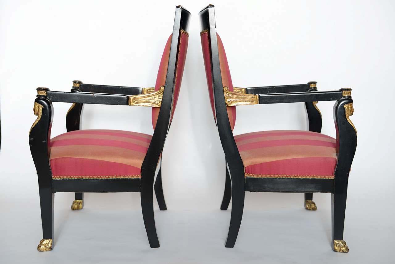 Upholstery Pair of Italian Neoclassic Ebonized and Parcel-Gilt Armchairs For Sale