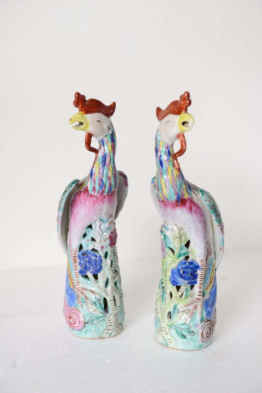 Pair of Chinese Porcelain Phoenix Birds, export, pierced base, finely painted, original condition

Fenghuang (Chinese: 鳳凰; pinyin: fènghuáng) are mythological birds of East Asia that reign over all other birds. The males are called Feng and the