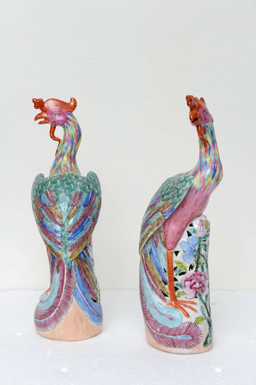 Large Pair of Chinese Porcelain Phoenix Birds, beautifully painted & detailed with pierced base. One of two pairs available, other being smaller

Fenghuang (Chinese: 鳳凰; pinyin: fènghuáng) are mythological birds of East Asia that reign over all