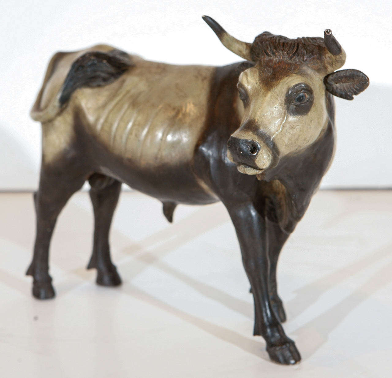 Rare, beautifully hand-carved and painted bull figurine with glass eyes from Naples, Italy. Originally intended for a nativity scene.