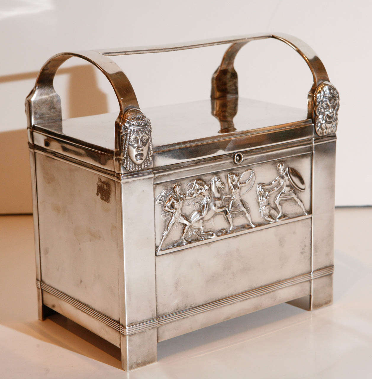 Silver plated, art-deco humidor featuring reproductions of the famous Bassae Frieze which depicts a battle between the Trojans and the Amazons.