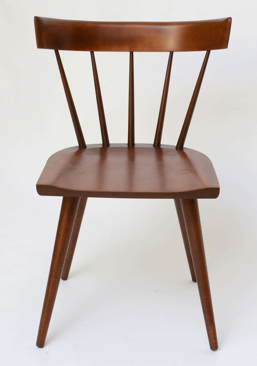 Reduced from $850. Iconic Paul McCobb Planner Group windsor style side chair, dining chair or desk chair in dark maple. Produced by Winchedon in the 1950s. Features lathe turned tapering legs, shaped seat and spindle back.

Measurements:
20 1/2
