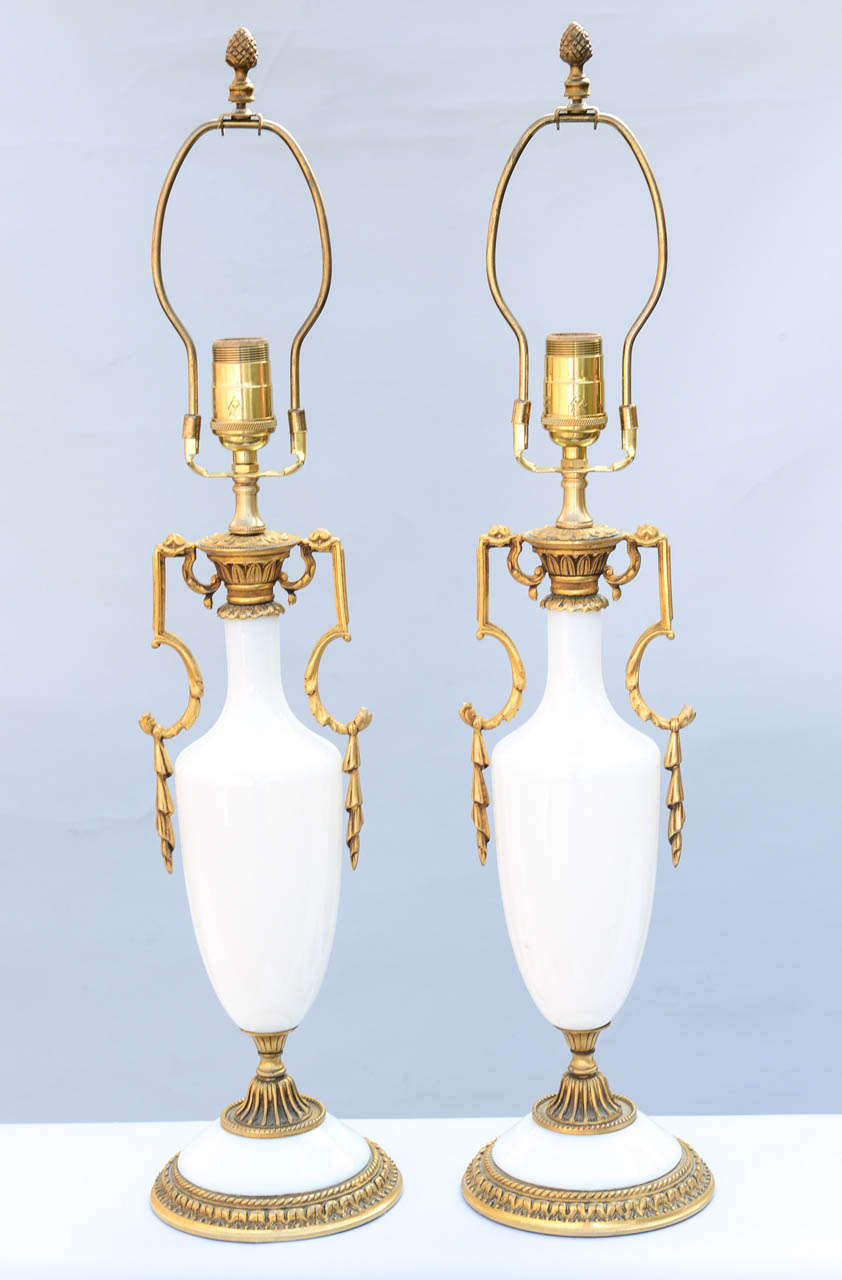 Magnificent pair of opaline glass lamps, urn shaped with finely chased dore bronze fittings.

Stock ID: D6737