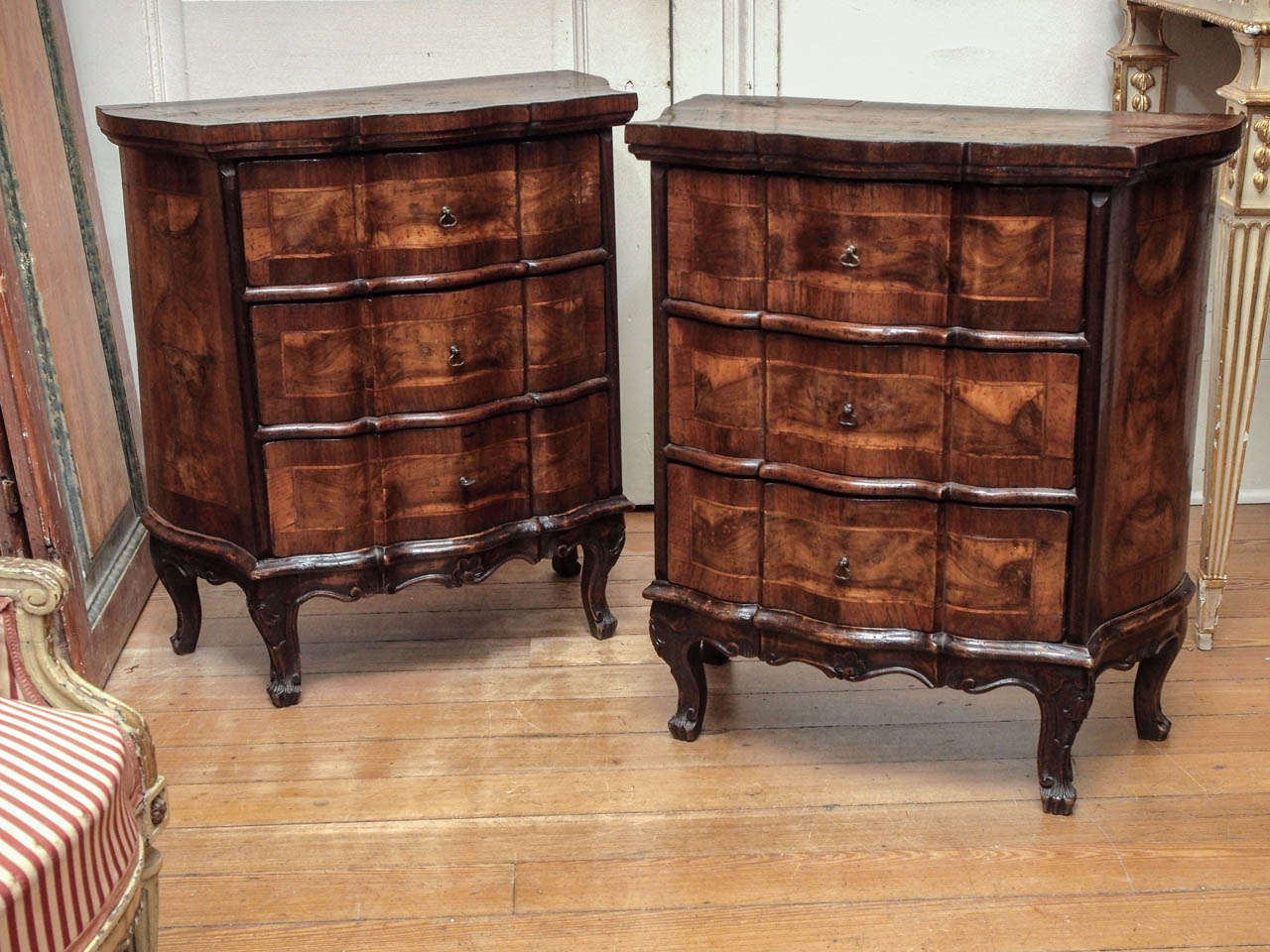 Pair of Italian Luigi XV Walnut Commodini with three drawers and shaped front and sides on cabriole legs.