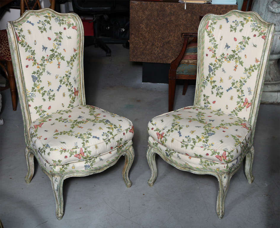 Charming pair of Louis XVI fireside chairs, reupholstered in Scalamandre fabric with butterflies and lady bugs.