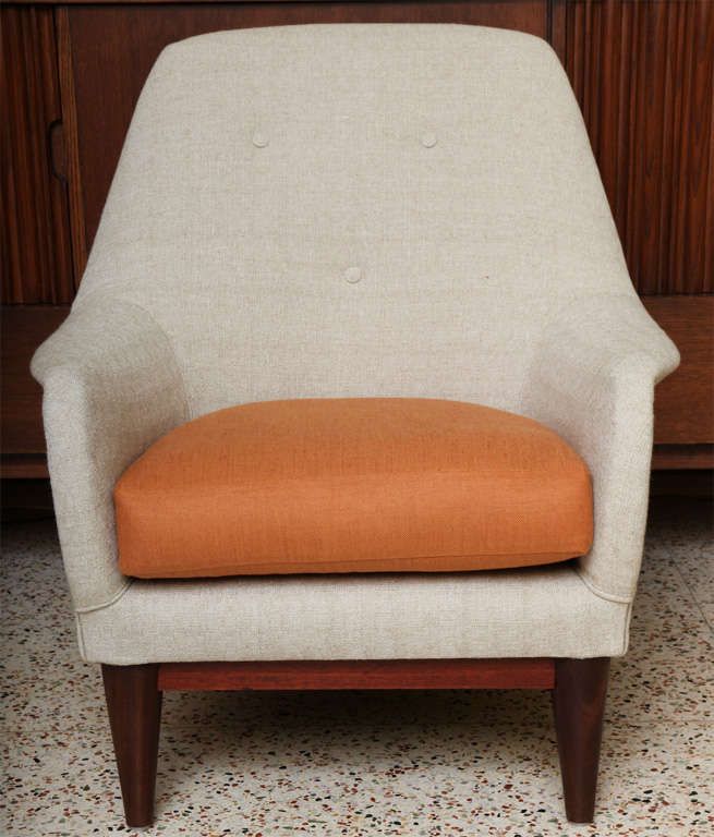 SOLD SEPT/12 Inviting, exciting & nicely scaled, this Scandinavian armchair definitely has Finn Juhl DNA in its bones. Exhibiting a wonderful profile with softly curving shape, rounded back, button back upholstery and contrasting seat cushion.