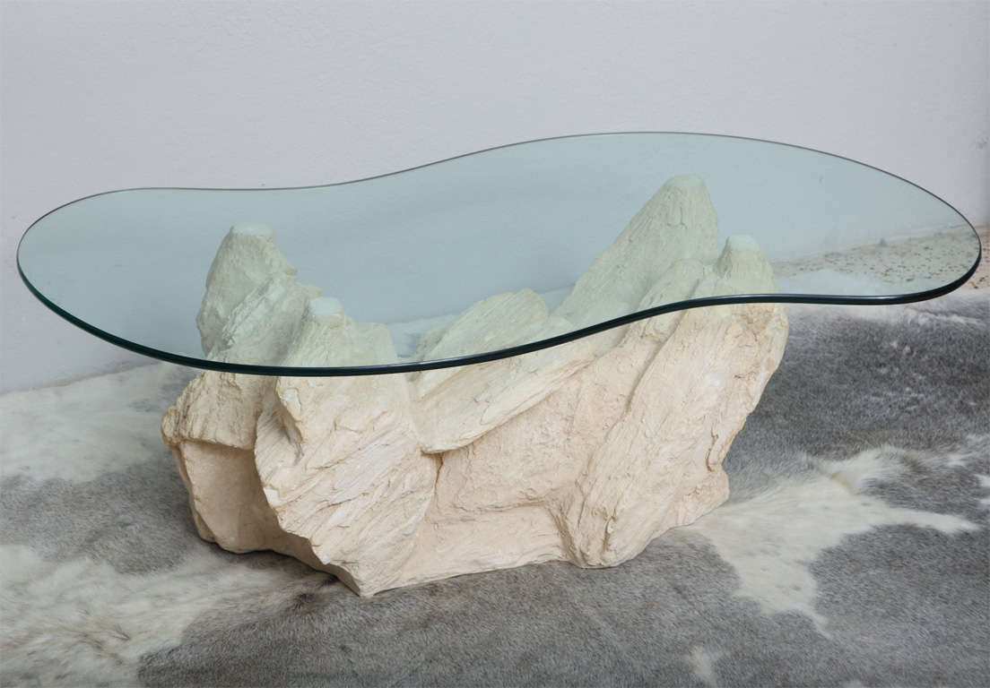 Fabulous cast-plaster, faux rock coffee table by Sirmos mimics the rocaille pieces of designers Emilio Terry and Serge Roche... timelessly chic!