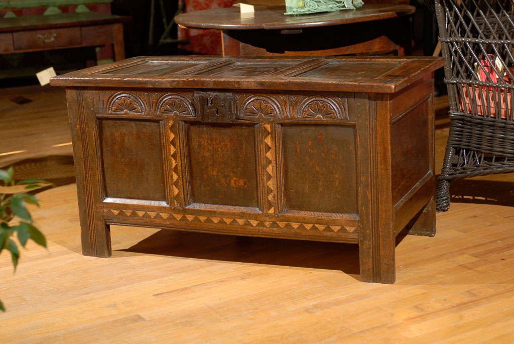 Coffers are believed to have preceded trunks. Coffers were used to store bedding.  The patina on this coffer is warm.  The inlaid details on the front panel and carvings are stunning.  

Please visit our website for more