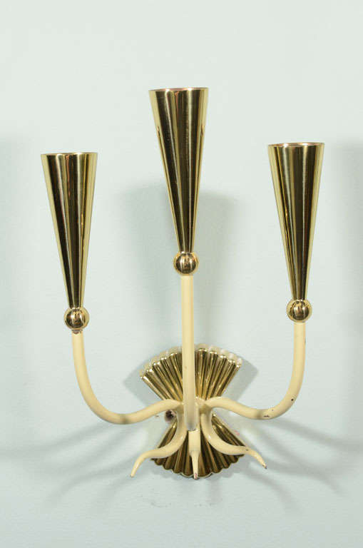 A pair of 1940s ivory enamel and brass three-light sconces. Brass newly polished and lacquered. Sold as a pair. Located in showplace antique + design center, nyc.