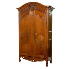 French 1740s Period Louis XV Walnut Armoire with Ribbon-Tied Floral Medallion