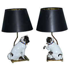 Antique A magnificent pair of Meissen porcelain pug dog lamps