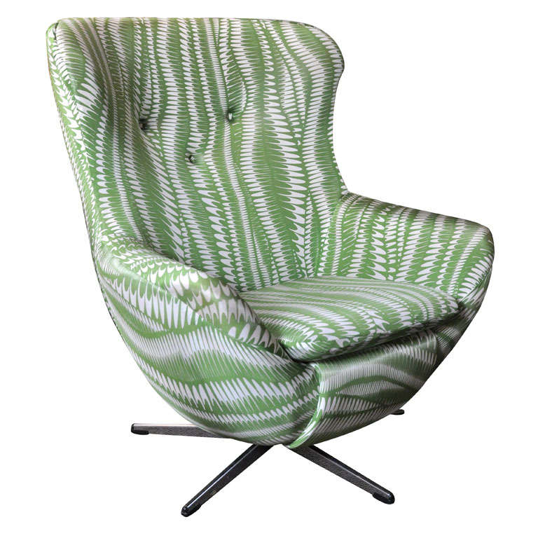 A vintage 'Egg' style chair upholstered in green and white swirl pattern soft nylon with metal swivel base.

Seat (cushion) depth: 17.5''.
Arm height: 19.5