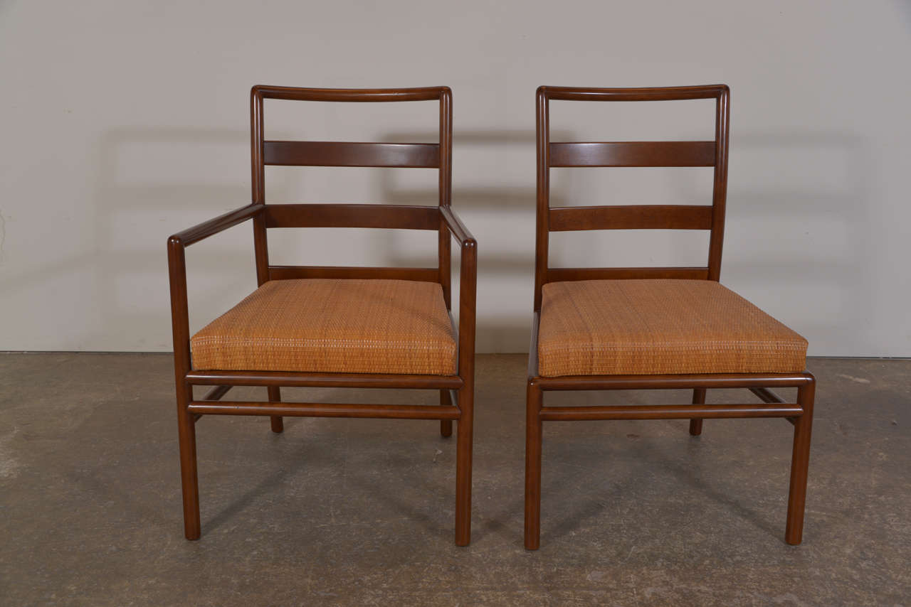 Set of six ladder back dining chairs by T.H. Robsjohn- Gibbibgs for Widdicomb Model 1585. The chairs are upholstered in a rattan textile. (2 arm chairs and 4 side chairs)