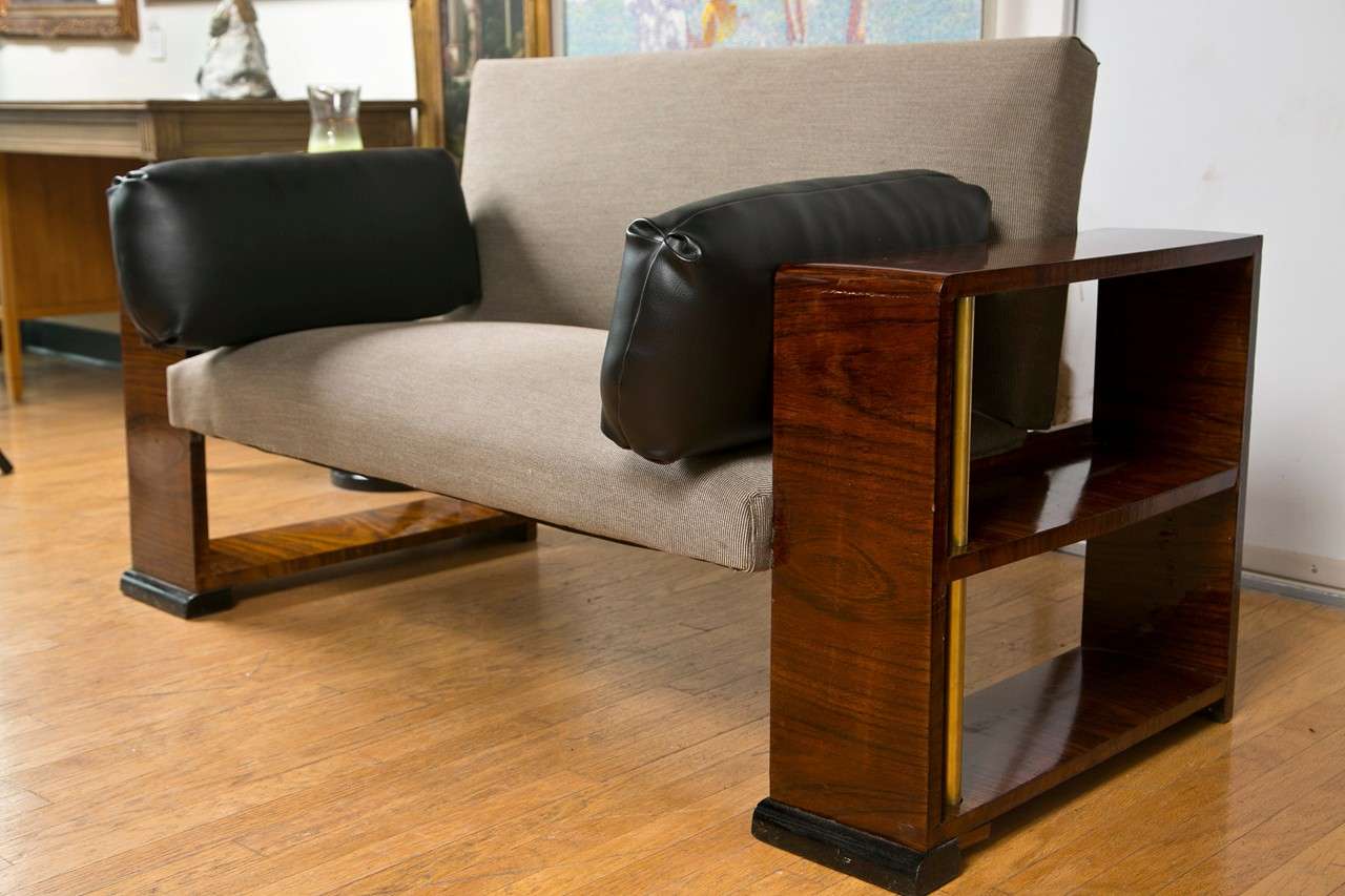 Unique piece - End tables are part of the settee. . Made of Rosewood with brass support poles. Black feet. End tables are 25