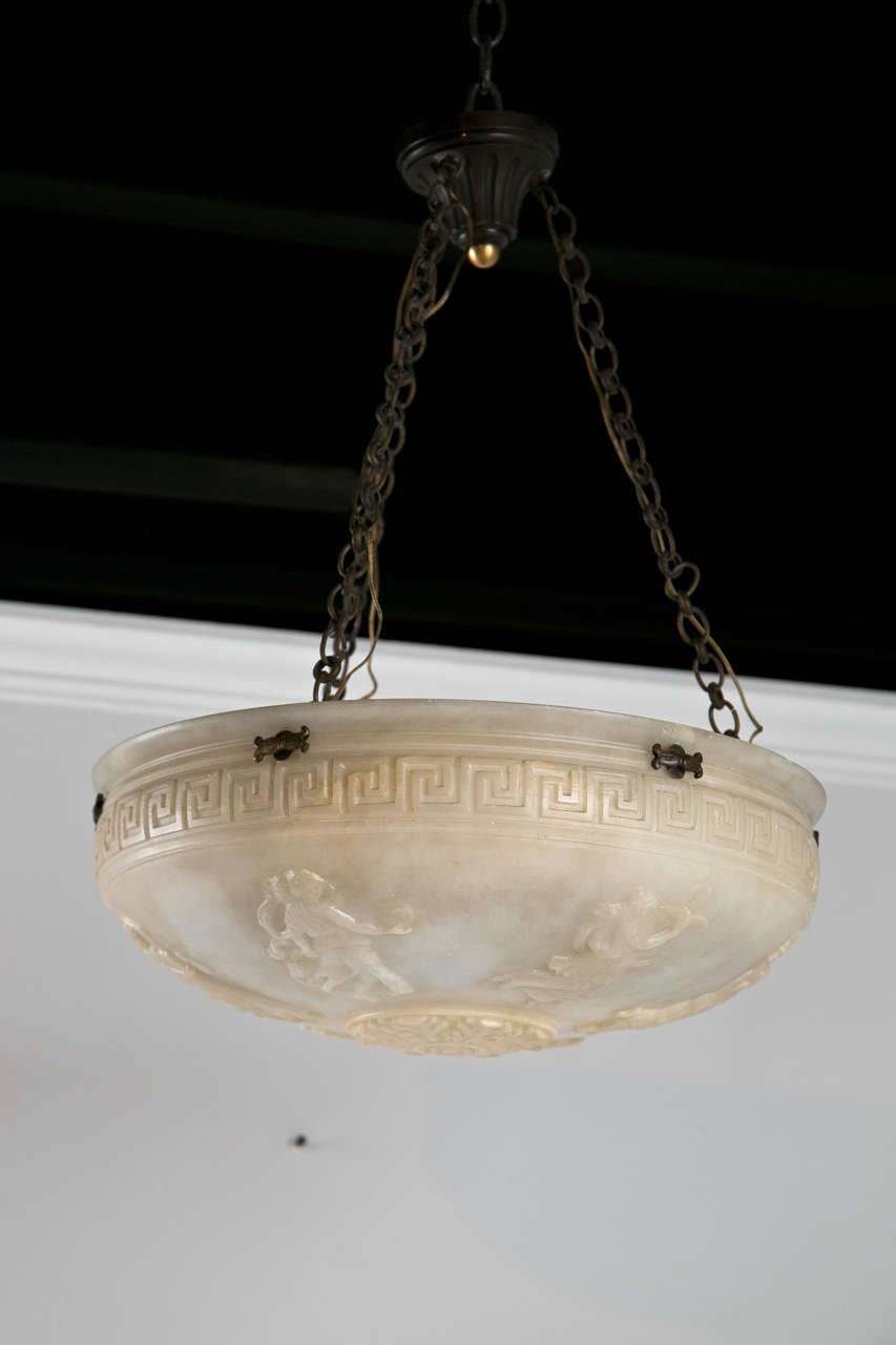 Circa 1900 French carved alabaster hanging pendant light fixture.
Greek key border with neoclassical figures.