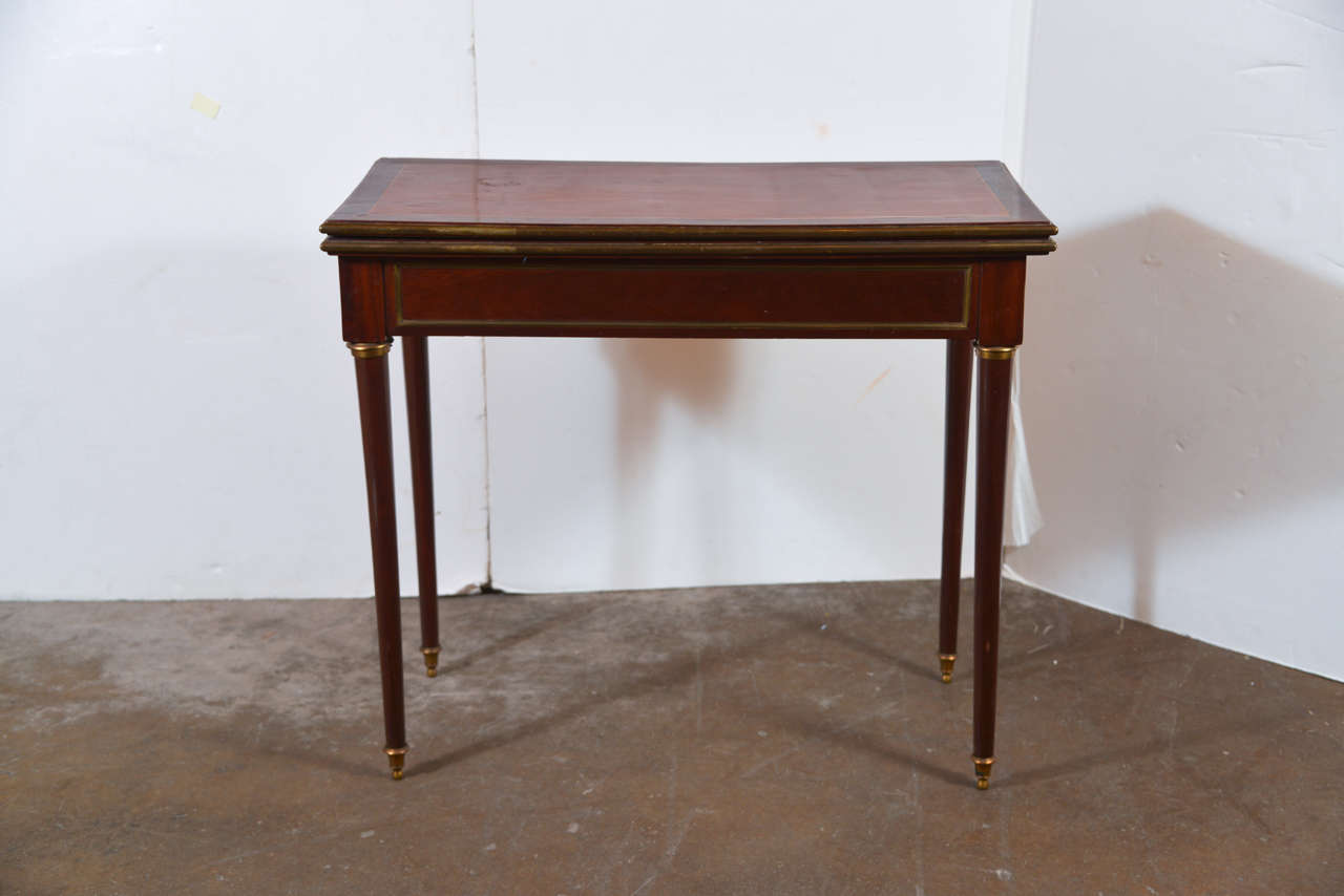 Continental Brass-Mounted Mahogany Game Table, 
folding top reveals blue felt game table top.
32-1/2