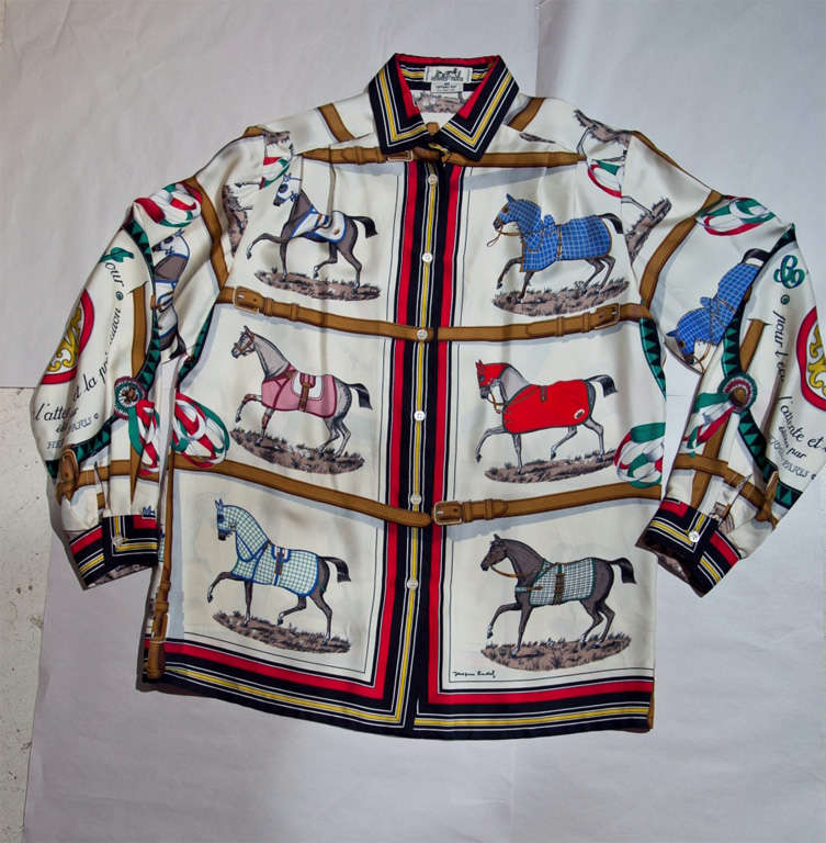 funkyfinders is pleased to present this sensational silk blouse from the house of hermes. the piece has an artist's signature along the front corner. it features 11 quadrants of impeccably detailed equestrian motifs. this museum-par garment, which